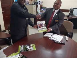  TMDA western zone manager Dr.Edgar Mahundi presenting TMDA clients service charter and annual performance report for the financial year 2018/19 to  the Regional Administrative Secretary for Kigoma region Mr. Rashid.Mchatta